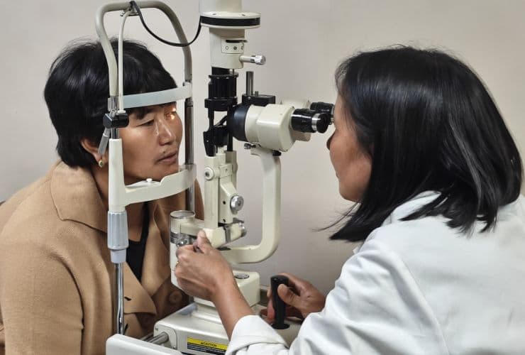 Surgeons performing eye surgery