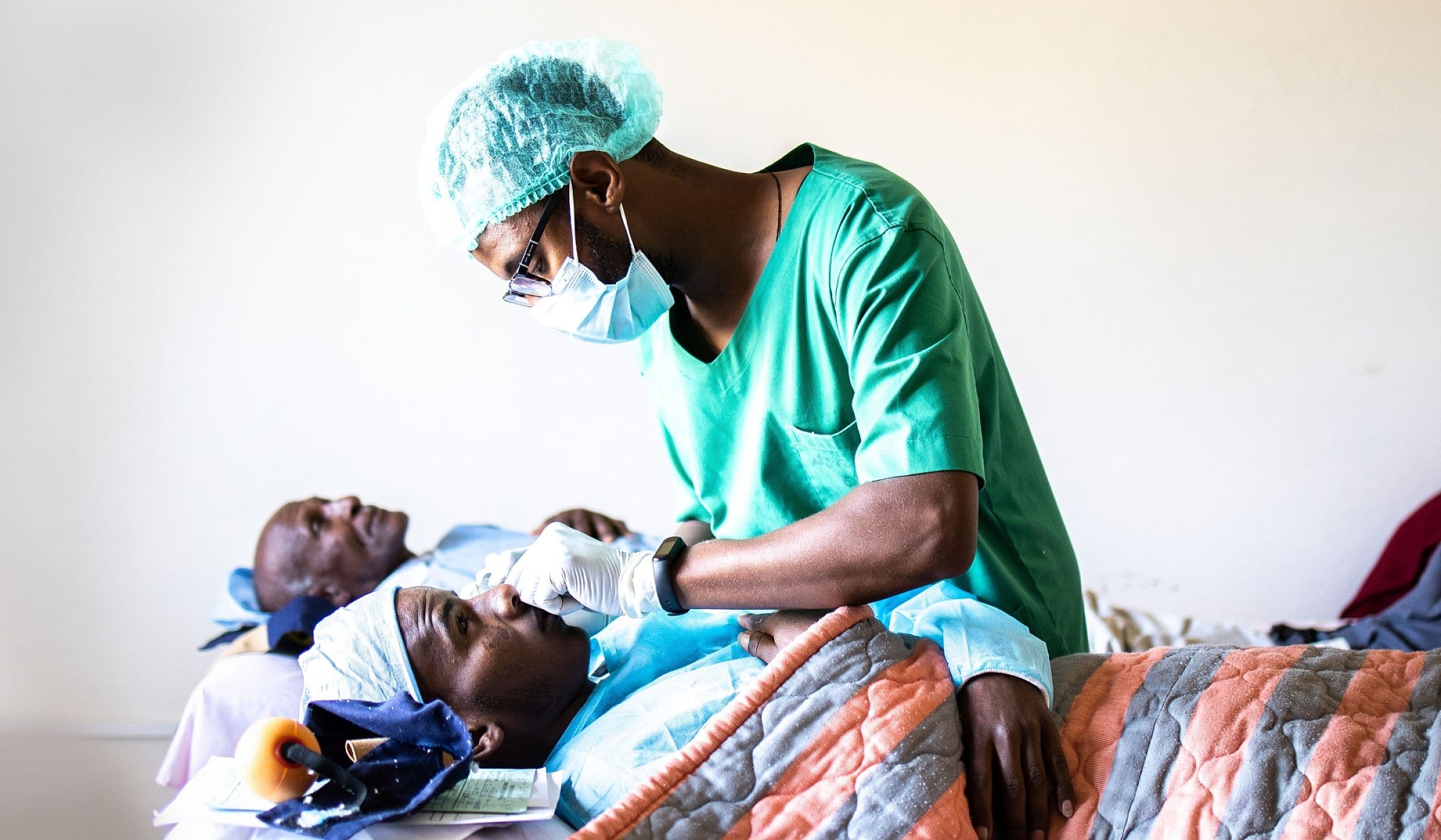 Surgeons performing eye surgery