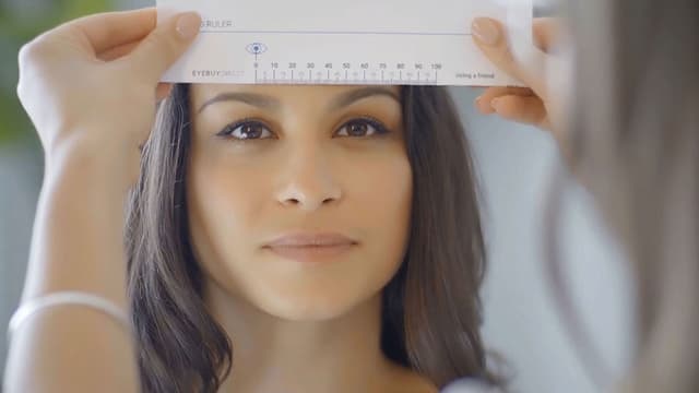 Illustration of a person measuring their PD in a mirror